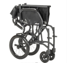Load image into Gallery viewer, A black convertible wheelchair shown folded, with large rear wheels, small front casters, and a mesh backrest on a plain white background. The brand name 'drive' is visible on the side of the seat.